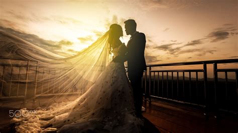 Wedding Couple With The Sunset Bride And Groom At Sunset Romantic