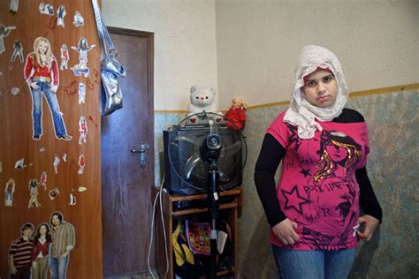 teenage girls in their bedrooms in photographs by rania matar