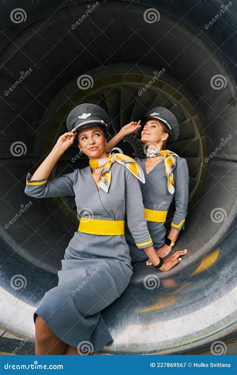 flight attendants  pilot caps seated   aeroengine stock