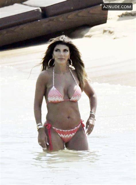 teresa giudice wows in a pink halterneck bikini while relaxing on the