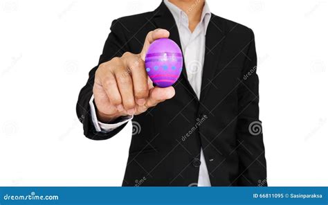 businessman holding easter egg isolated  white background stock