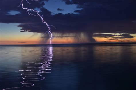 kari likelikes lightning reflecting   water nature