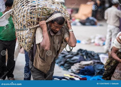 man carry  sack     kathmandu streets editorial image image  onion architecture