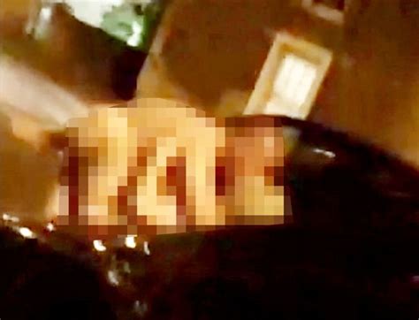randy middle aged couple filmed having sex naked on car bonnet in middle of residential street