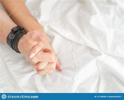 Close Up Hands Of A Couple Make Love Hot Sex On A Bed