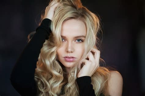 women blonde blue eyes face hands in hair maxim