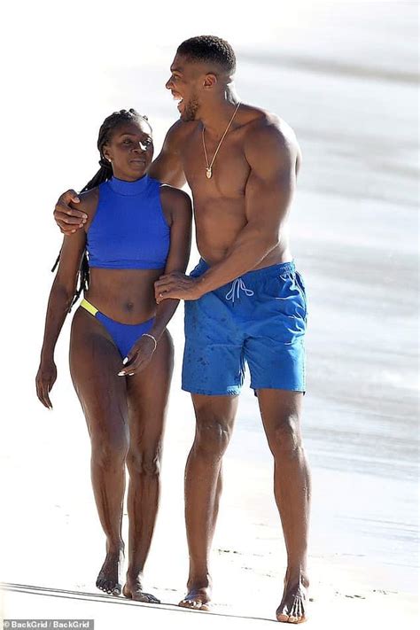 anthony joshua vacations in barbados beach with a female