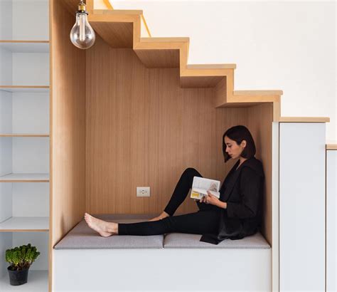 stair seating nook lined  wood creates  cozy place  reading  relaxation