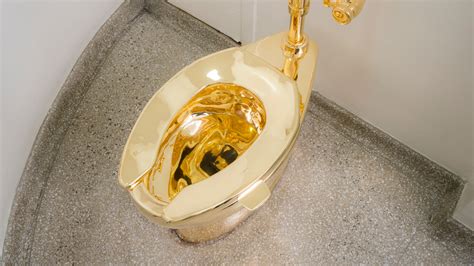 solid gold toilet   removed  guggenheim  september