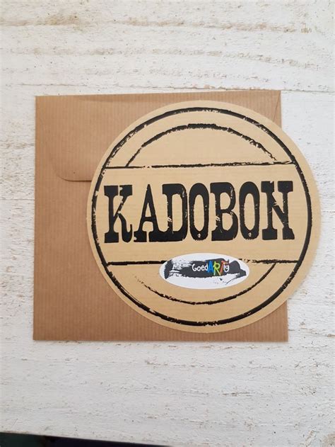 sticker   word kadobon   sitting  top   piece  cardboard