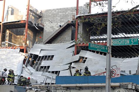 fdny building collapse claims life     workers rescued
