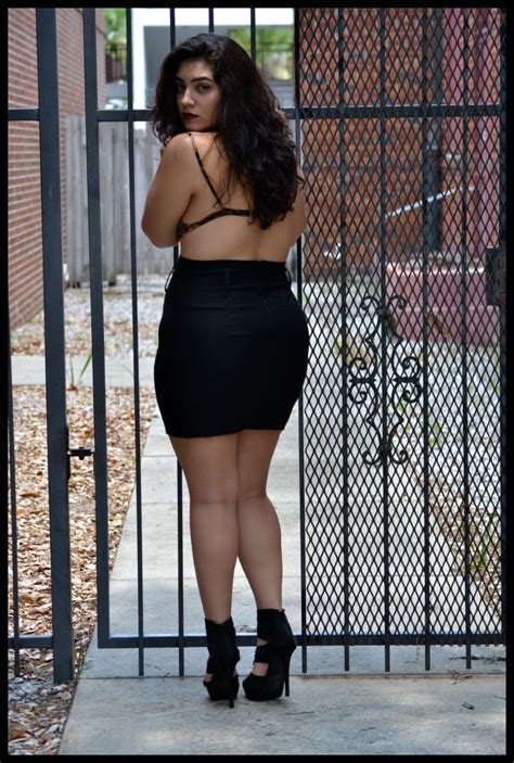 plus size curvy gorgeous thick lady in all black mini skirt showing her