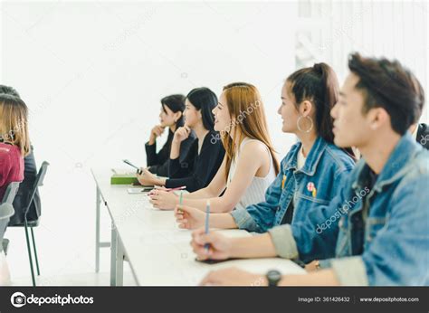 asians attend seminars listen lectures speakers training room