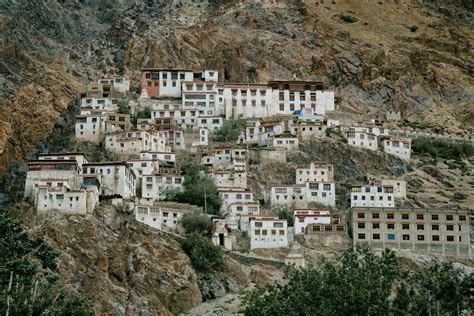 ancient tibetan monastery located  mountain slope  wild valley  stock photo
