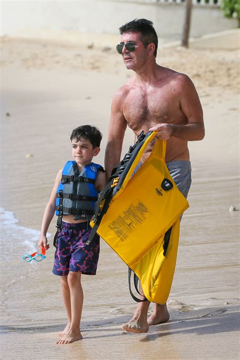 simon cowell seen on vacation with stepson caring dad does not want