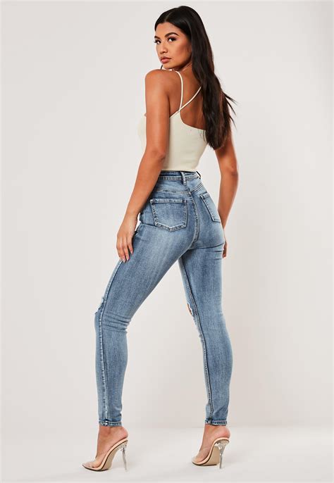 blue sinner high waisted open knee skinny jeans missguided