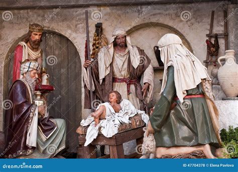 indoor nativity scene stock photo image  praying holidays