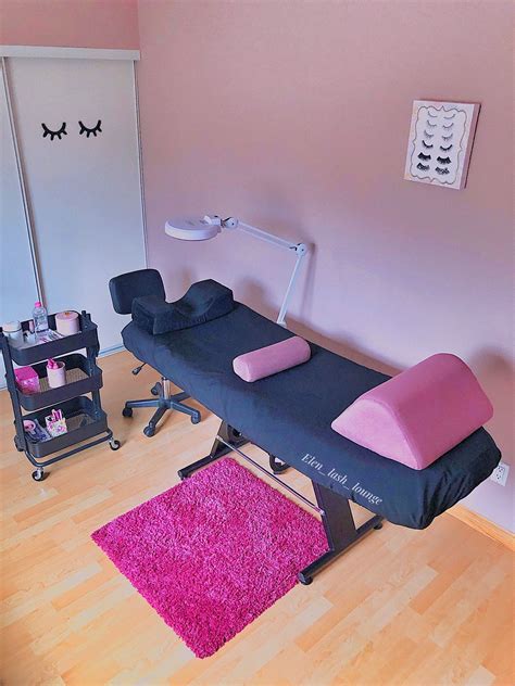 A Pink And Black Beauty Room With An Electric Facial Massage Bed On Top
