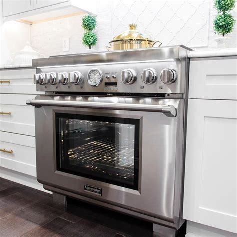 stainless steel oven   white kitchen