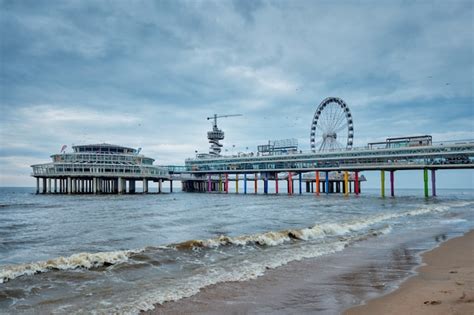 premium photo  scheveningen pier strandweg beach   hague  ferris wheel  hague