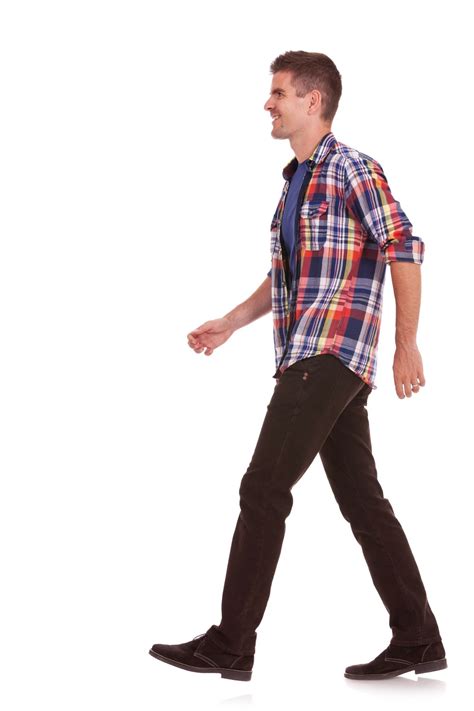 side view   young casual man walking   white