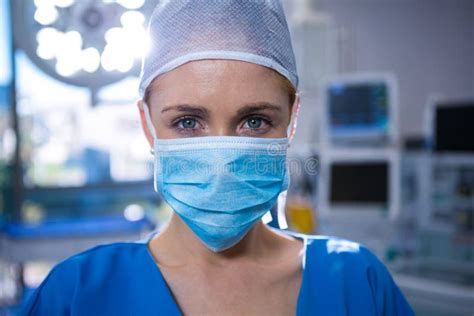 portrait  female surgeon wearing surgical mask  operation theater