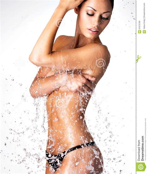 Beautiful Naked Woman With Wet Body And Splashes Of Water