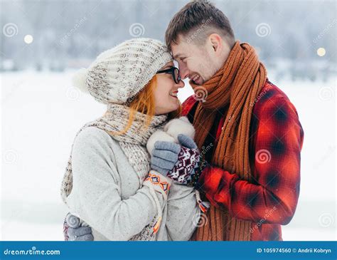 Sensitive Winter Portrait Of The Smiling Loving Couple Hugging And