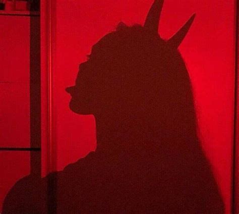 red aesthetic girl  devil horns shadow