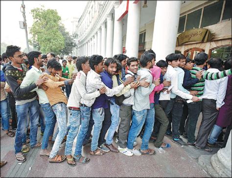 people line up outside a bank in new delhi india on tuesday days after the government announced