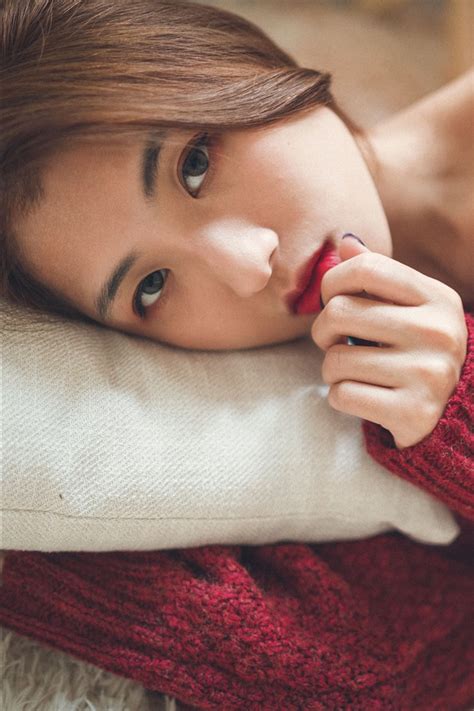 wallpaper asian girl look at you red sweater bed 7680x4320 uhd 8k picture image