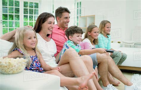 family watching television  stock photo dissolve