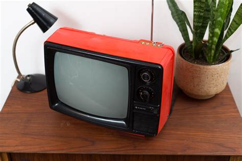 vintage orange television retro small sanyo analogue tv   japan handheld portable
