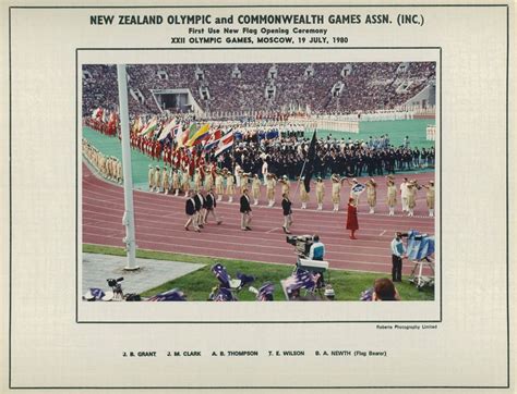 flag bearer brian newth leads the new zealand team into