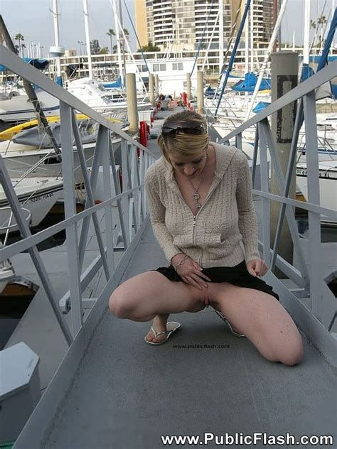 big tit blonde exhibitionist stripping nude on public boat docks pichunter