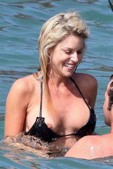 carrie prejean nipple slip in black bikini on beach paparazzi pictures and posin pichunter
