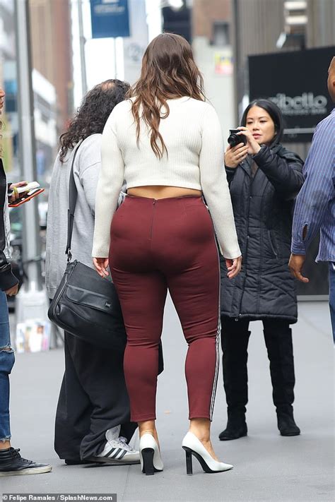 ashley graham flashes her tummy in crop top as well as her backside as