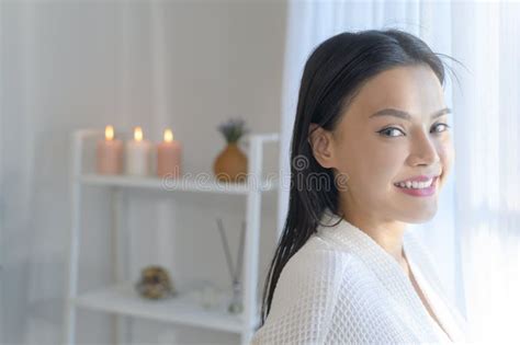 Portrait Of Young Smiling Asian Beautiful Woman Wearing White Bathrobe