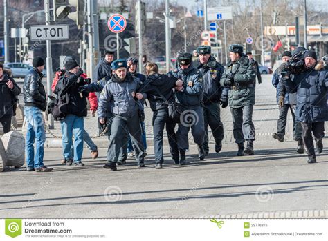 police arrests one of the activists on picket to free riot