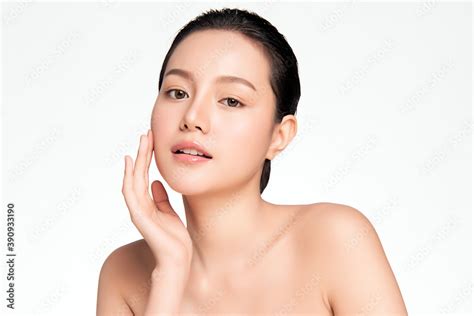 Beautiful Young Asian Woman With Clean Fresh Skin On White Background