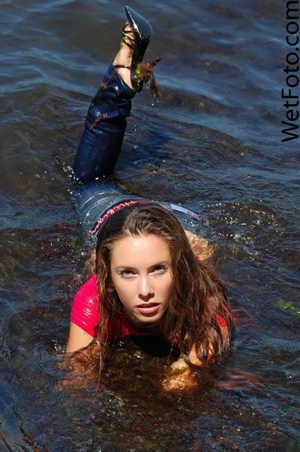 wetlook by happy girl in jeans pink blouse and high heels on sea wetlook one