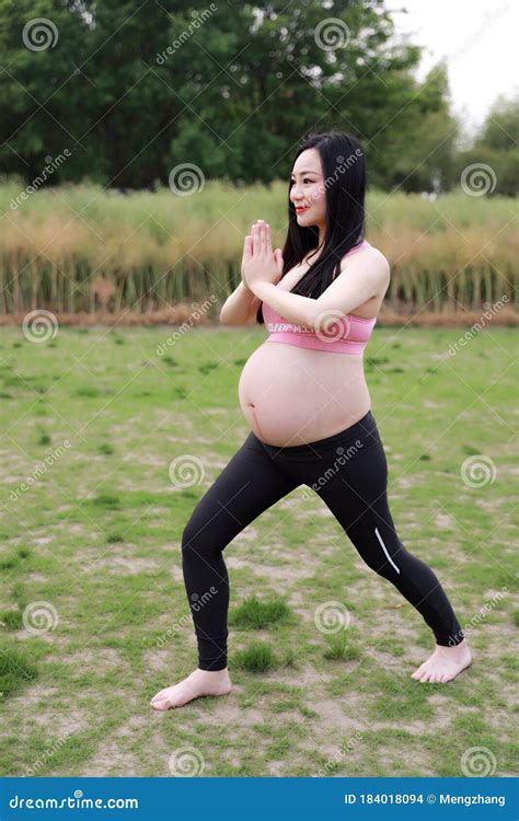 Happy Smile Asian Chinese Pregnant Woman In Yoga Dress Do Meditation In