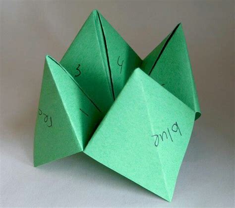 paper folded fortune game called  cootie catcher folding instructions included origami