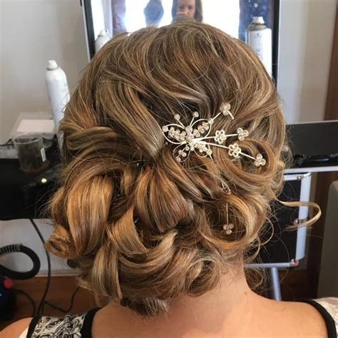 curly loose asymmetrical updo mother of the bride hair bride