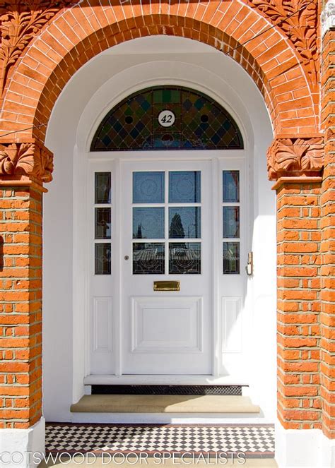 large edwardian front door  arched top frame cotswood doors
