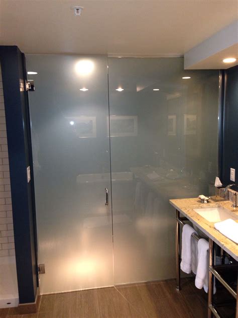 frosted glass toilet enclosure   mn campus hotel open plan bathrooms bathroom design