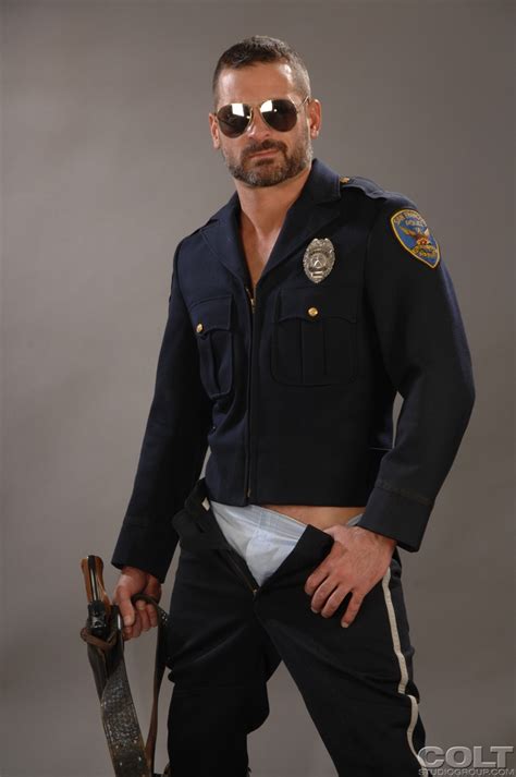 hot gay cop with a sexy beard does a naughty striptease