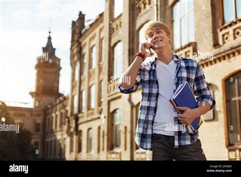 cheerful lively guy receiving  call stock photo alamy