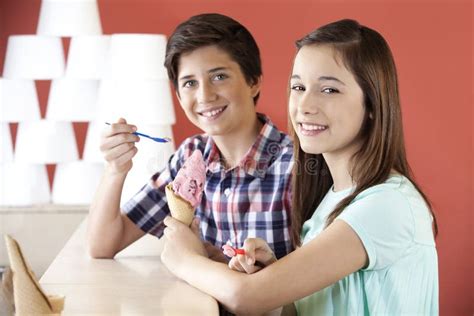 brother and sister having vanilla ice cream stock image image of