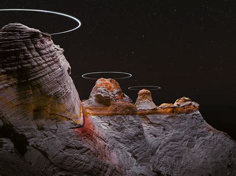 long exposure drone photographs create light halos  mountains